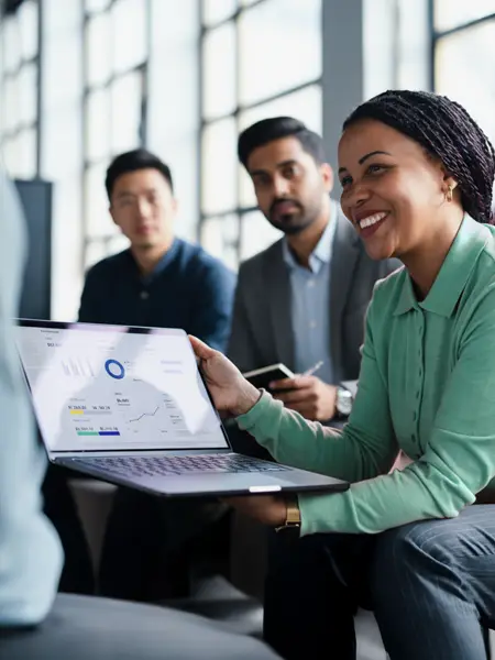 Smiling businesswoman among a sales team meeting for a B2B sales talent report.